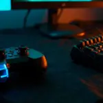 A controller and keyboard representing GTA 5 cheat codes for console and PC